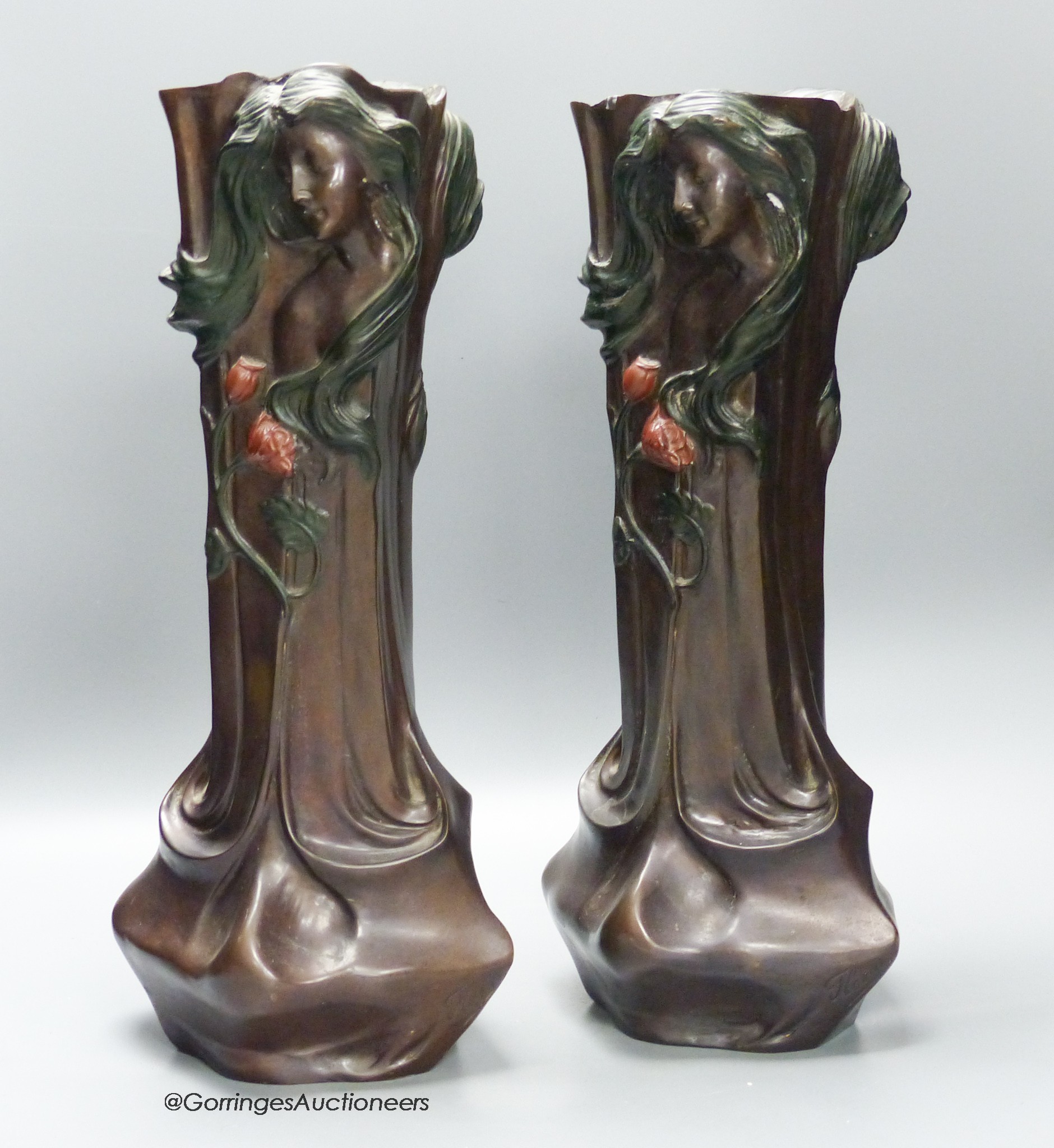 A pair of Art Nouveau style cold painted bronze figural vases, signed Flora, 42.5cm high